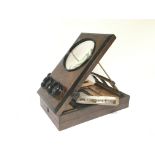 An Early 20th century burr walnut three D viewer.