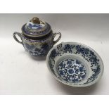 A Chinese blue and white porcelain bowl with brown
