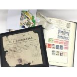 A stamp album containing a good selection of world