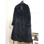 A black mid length rabbit fur coat - NO RESERVE