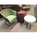 A collection of three Lloyd Loom items consisting of a green chair, a red lidded laundry basket