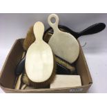 A box of Ebony and Ivory dressing table items.