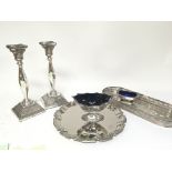 A pair of silver candle sticks with loaded bases L