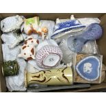 A box containing a collection of various china and