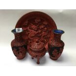 A Cinnibar ornately carved lacquer dragon and pear