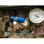 A box containing carriage clocks compasses and bar