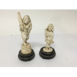 Two late 19th century carved ivory figures on hard