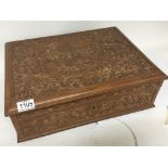 An Indonesian carved hardwood stationary box with