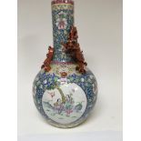 A 19 th century Chinese bottle vase the neck with