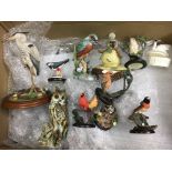 A box containing a large collection of bird figure