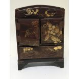 A small Japanese lacquer cabinet with drawers deco