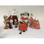 A Royal Doulton figure The Judge, three Goebel fig