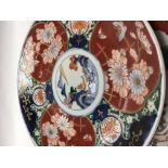 Two Japanese Imari chargers decorated with flowers