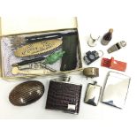 A box of various interesting items including a hip