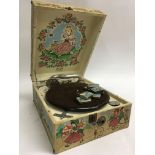 A child’s cased Decca gramophone with 6 tins of Sp