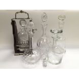 A decanter and tantalus together with four other d
