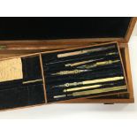 An antique mahogany cased draftsmans set with inse