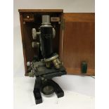 A Vintage microscope in a fitted mahogany box make