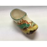A Clarice Cliff clog decorated in the secrets patt