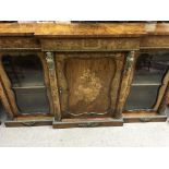 A fine Victorian walnut break front credenza With