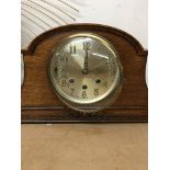 A oak case mantel clock the silvered dial with Ara