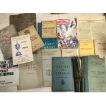A collection of wartime booklets.