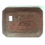 A carved cinnabar lacquered tray with a detailed c