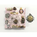 A collection of badges including Boy Scouts, Girls