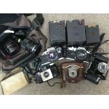 A box containing a collection of cameras including