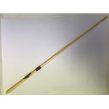 An ivory swagger stick with white metal mounts.