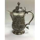 An 18th Century silver jug, originally a tankard,