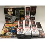 A collection of modern Star Wars figures in boxes,