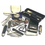 A quantity of various pocket knives, corkscrews an