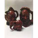 Two royal Doulton Flambé character jugs and a matc