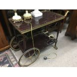 A two tier rosewood effect tea trolley.