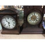 Two mantal clocks with Roman numerals.and a brass