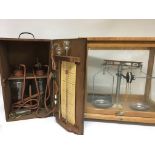 An oak cased beam balance scale and a mahogany box