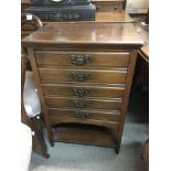 A walnut music cabinet, approx 52cm x 36cm x 77cm.