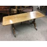 A mahogany coffee table raised on splayed legs, ap