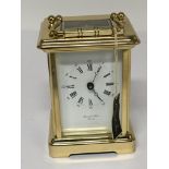 A brass carriage clock in good condition seen work