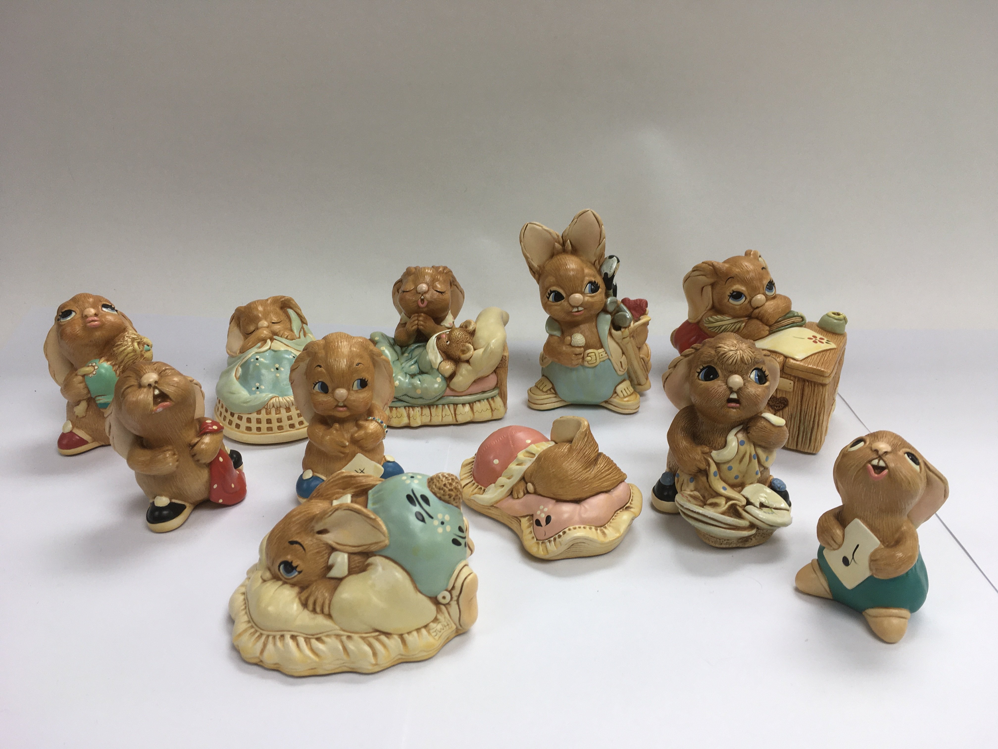 A collection of Pendelfin figures of rabbits.