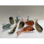 A collection of glass paperweights in the form of