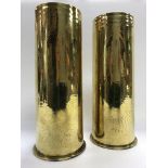 A pair of brass shell cases dated 1917