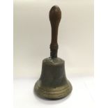 A vintage large brass handbell.