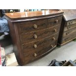 A bow front mahogany chest of drawers, approx 117cm x 46cm x 105cm.