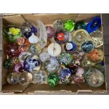 A large collection of paperweights, different size