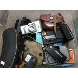 A box of cameras and a cased pair of binoculars -