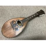 An Italian mandolin inlaid with mother of pearl an