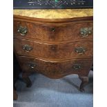 A Small walnut serpentine Fronted chest of three d