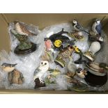 A large collection of various bids figures, some h